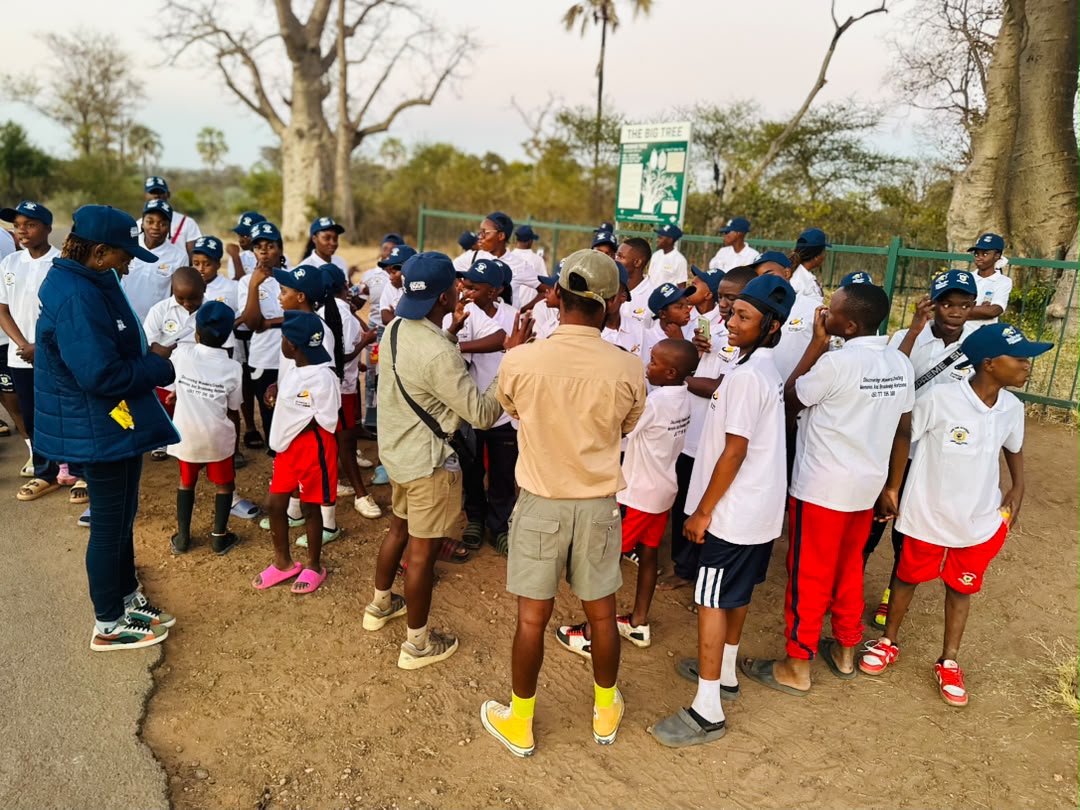 Learners gathered for an outdoor briefing during the Victoria Falls trip